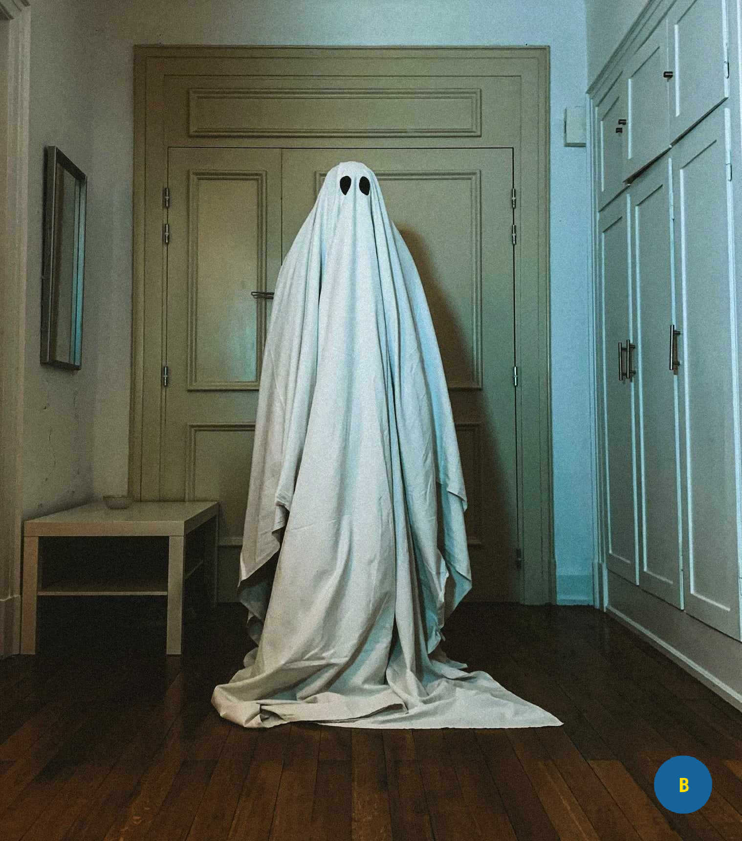 a ghostwriter dressed like a ghost in a sheet